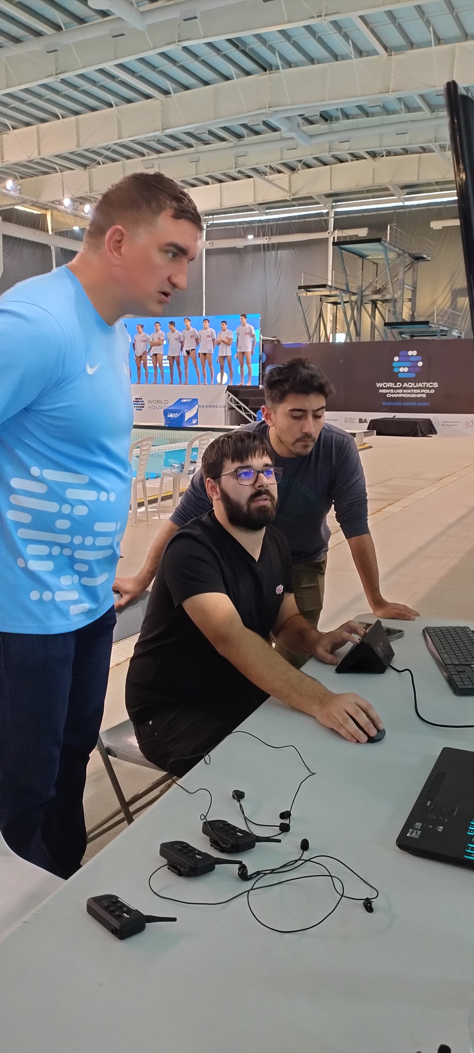 Referee and operators at the VAR review station